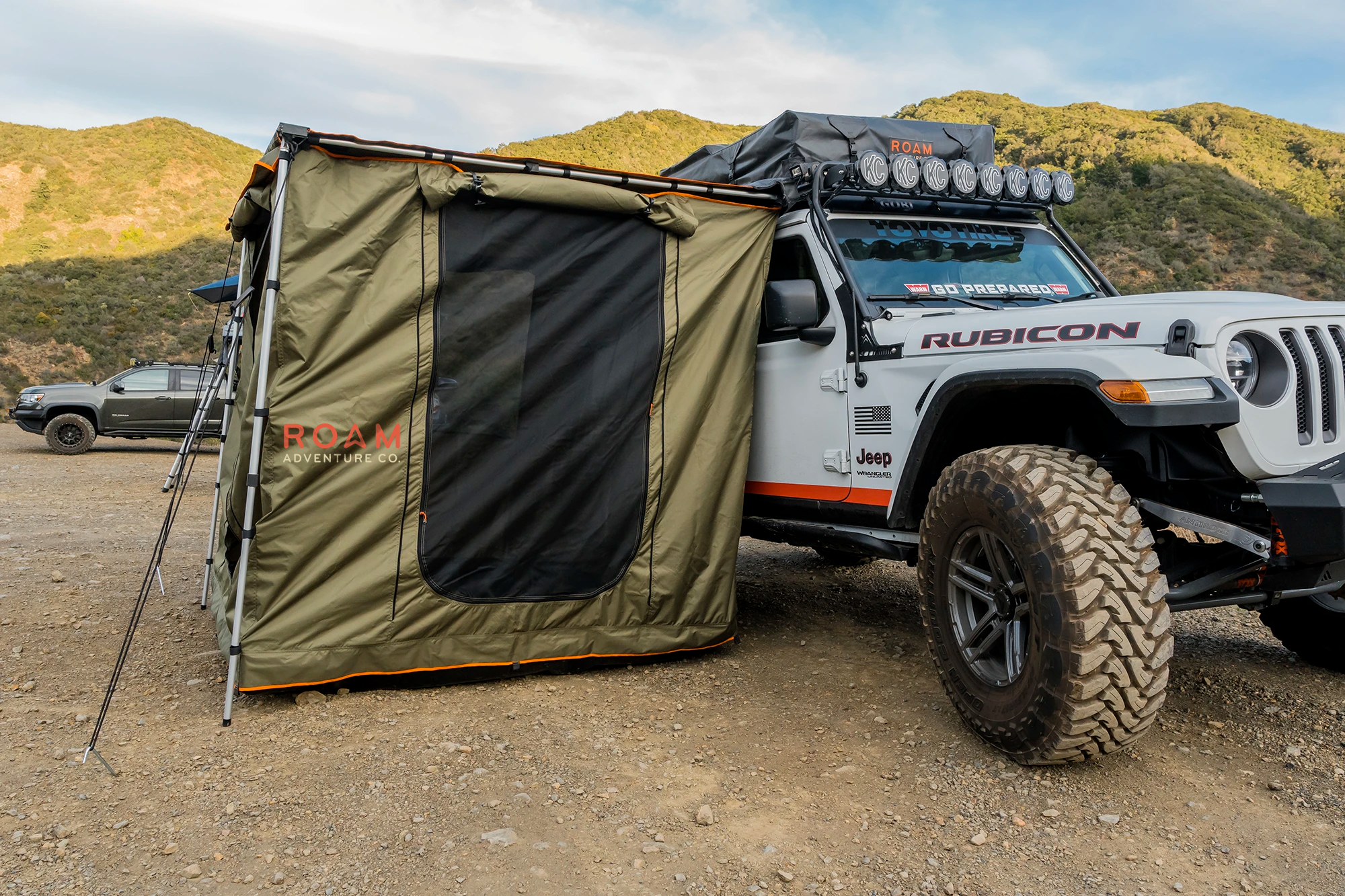 ROAM Adventure Co. Rooftop Awning Room in Forest Green shown on a Jeep Rubicon